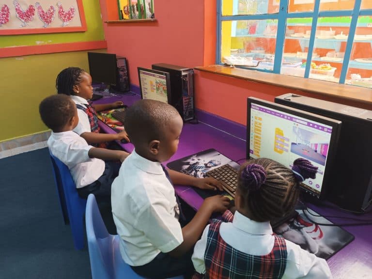 Primary learners in uniform coding on classroom computers