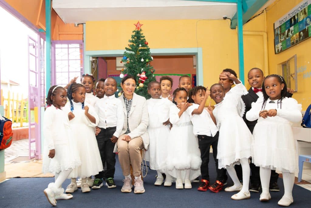 Children dressed for the Christmas concert with their teacher